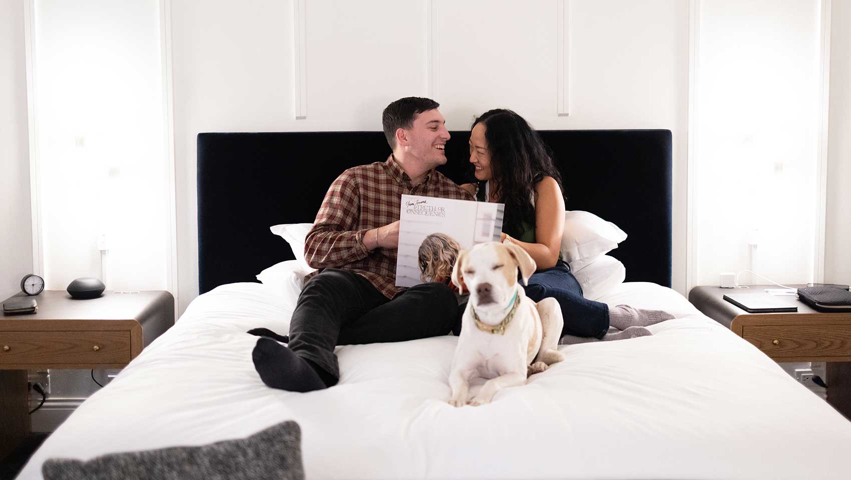 Couple in bed with dog at Kimpton Alton Fisherman's Wharf