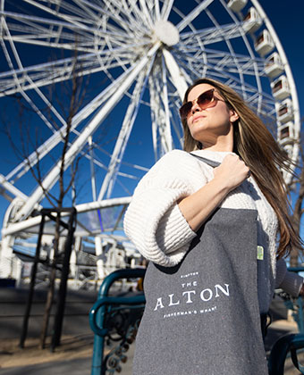 Woman in front of ferris wheel