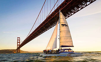 sailboat in front of Golden Gate Bridge