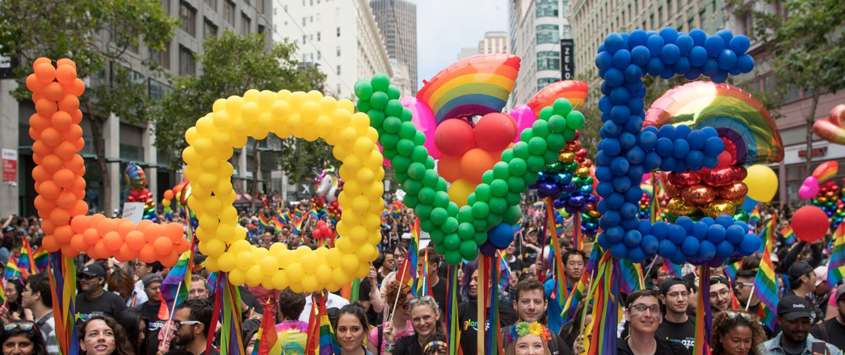 SF Pride Parade attendees with balloons