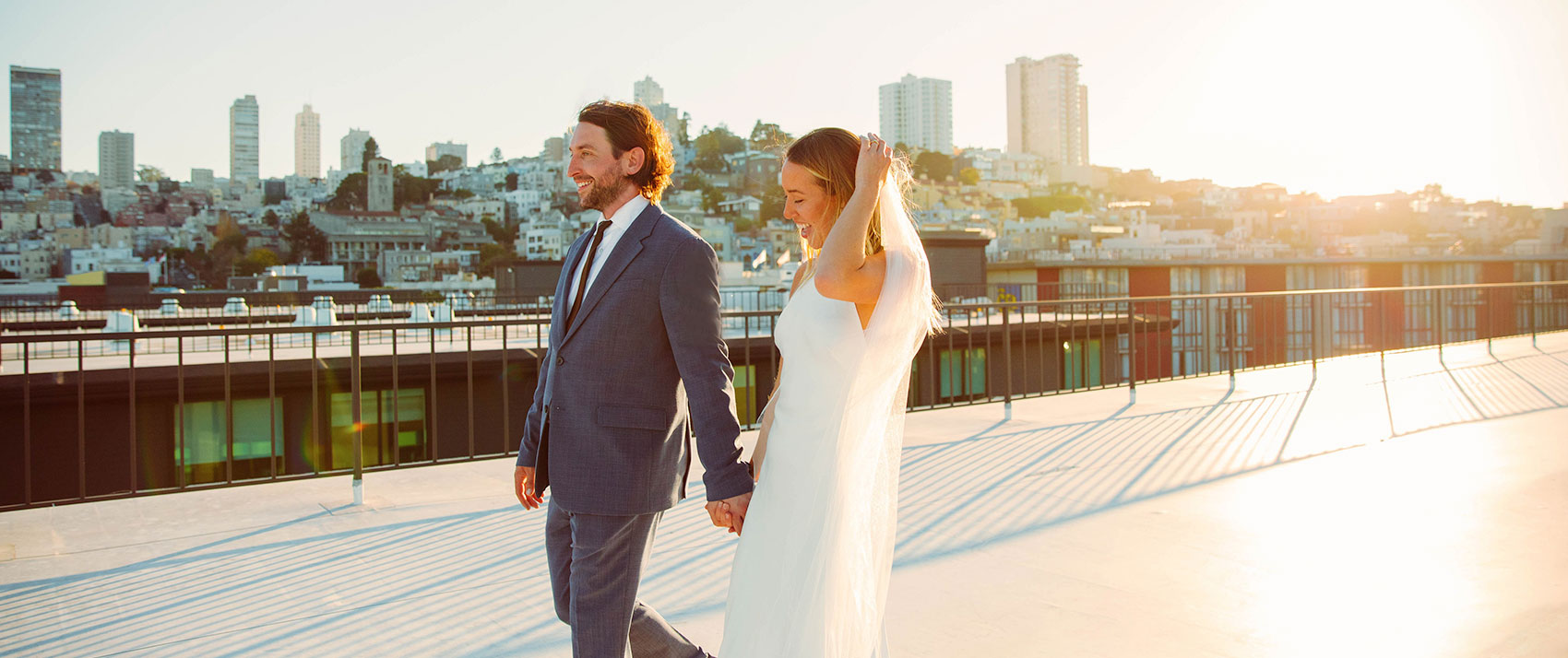 wedding couple with city skyline in the background